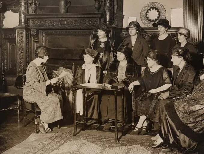 American Alice Paul, leader of the militant National Women's Party meeting with English feminists at American Woman's Club in London. (l to r) Alice Paul, Elizabeth Robins, Viscountess Rhondda, Dr. Louisa Martindale, Mrs. Virginia Crawford, Dorothy Evans, Standing: Emmeline Pethick-Lawrence, Alison Neilans, Florence Underwood, Miss Barry.