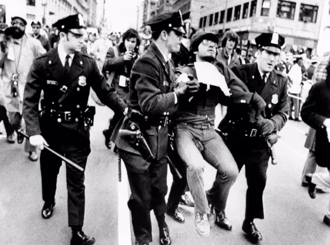 Protester arrested at President Richard Nixon's 1973 Inauguration. Police drag away an antiwar demonstrator from the Inaugural Parade. Jan 20, 1973.