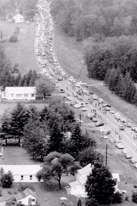 Leaving Woodstock Music Fair. Aerial view of cars crowded on a highway about 10 miles from the Woodstock Music and Art Fair as some 450,000 young people head home from the 3 day festival. Aug. 17, 1969.