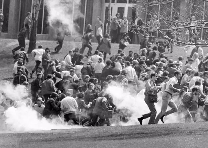 Tear gas disperses crowd on Kent State University Commons. Shortly afterward National Guardsmen fired 67 rounds in 13 seconds into a crowd of 500 Anti-Vietnam War protesters. 4 students were killed and 9 others wounded. May 4, 1970.