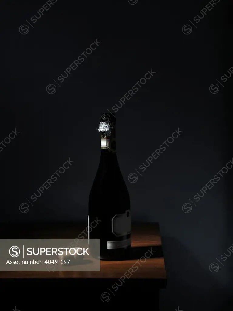 Champagne bottle with a cork on a table