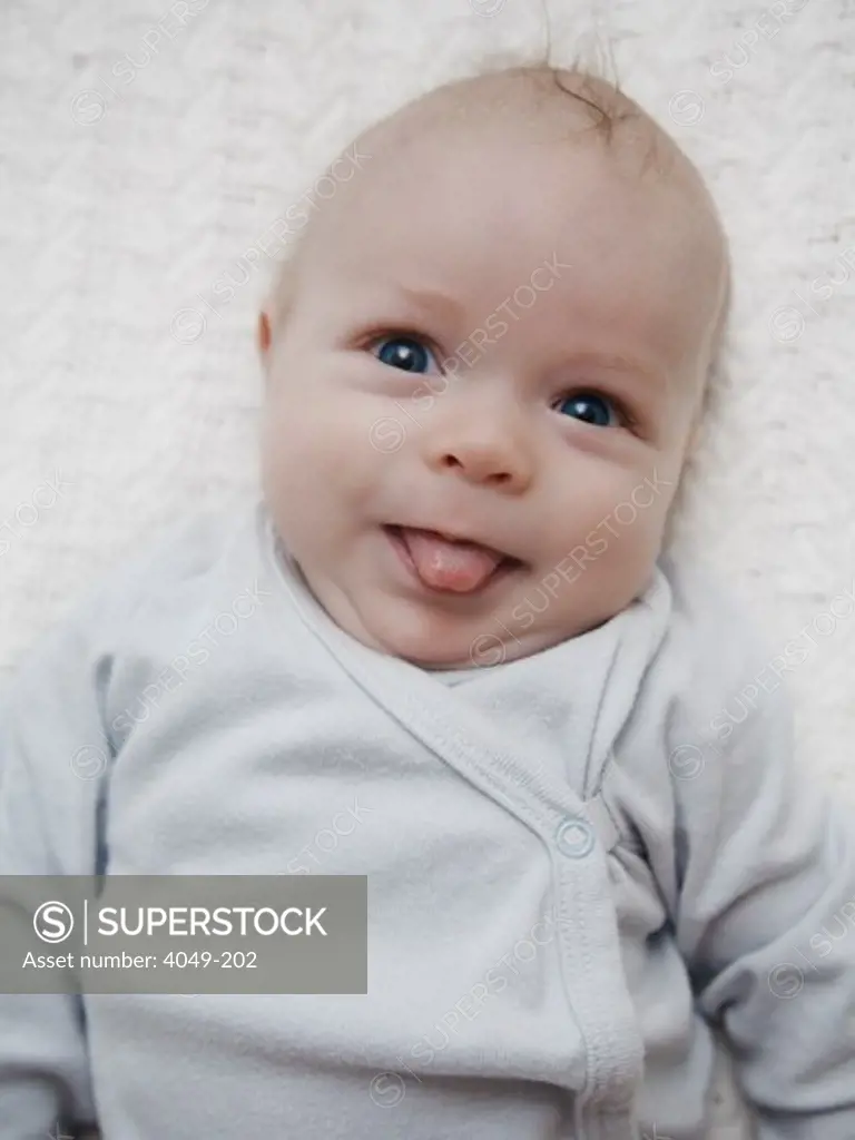 Close-up of a baby sticking its tongue out