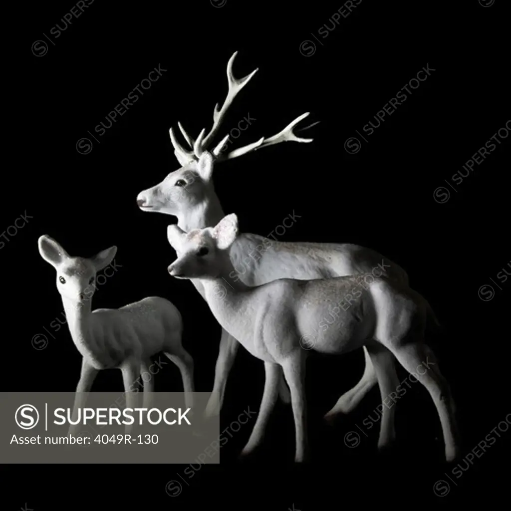 Close-up of figurines of deer family