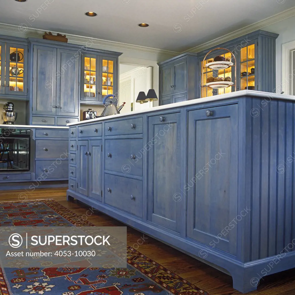 KITCHENS: Detail of island cabinets with blue transparent stain.
