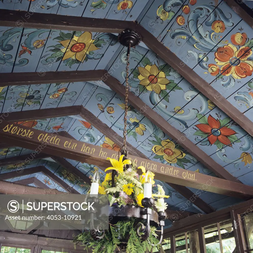 WALLS/CEILINGS - (Norwegian floral painting) decorates between beams with English and Norwegian sayings, chandelier decorated with  fresh flowers,