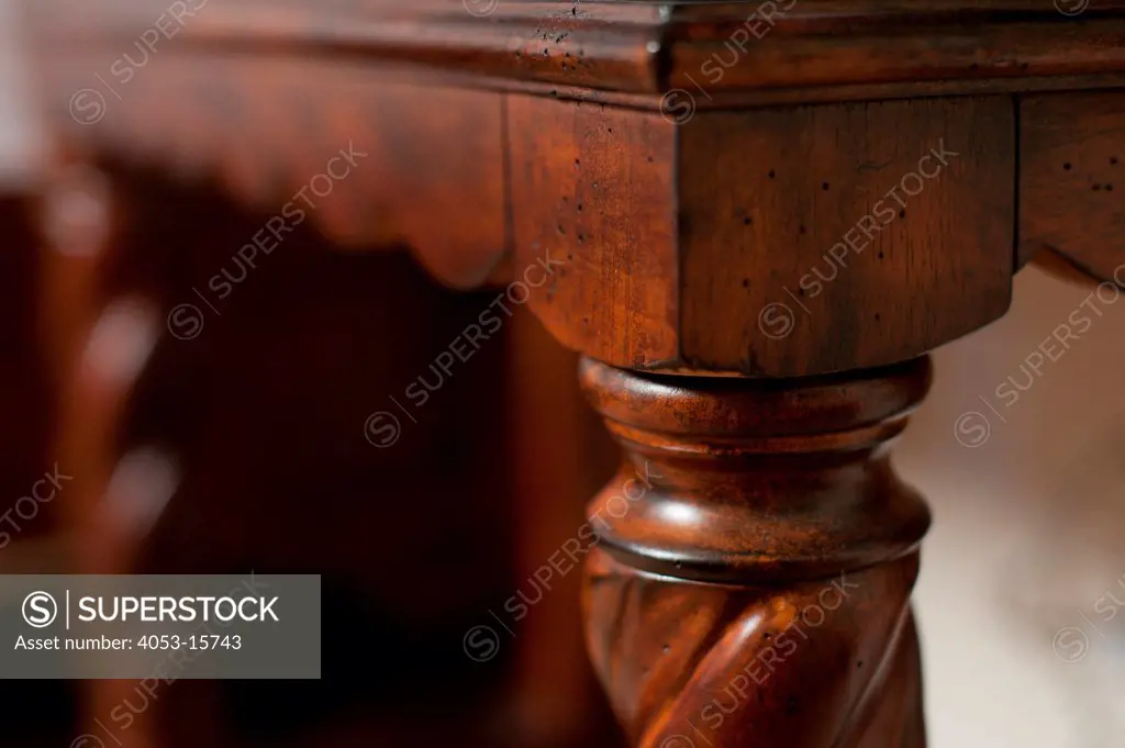 Detail of designed wooden table leg against blurred background, Scottsdale, USA. Arizona, USA. 01/25/2013