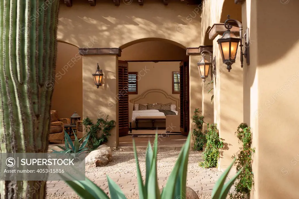 Lit lanterns and walkway leading to bedroom through open doors, Scottsdale, USA. Arizona, USA. 01/25/2013