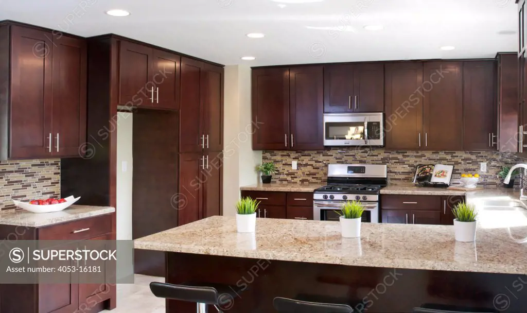 Interior of kitchen with wooden cabinets, Laguna Beach, California, USA. 02/28/2012