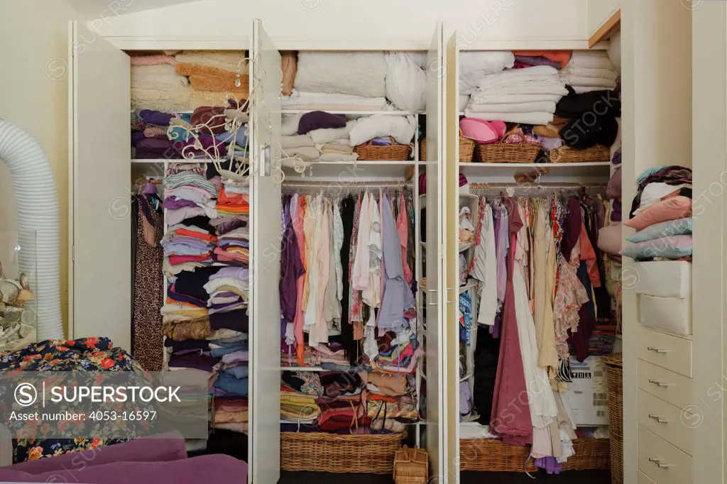Close-up of clothes stacked in wardrobe at house, New South Wales, Byron Bay, Australia. 02/06/2012