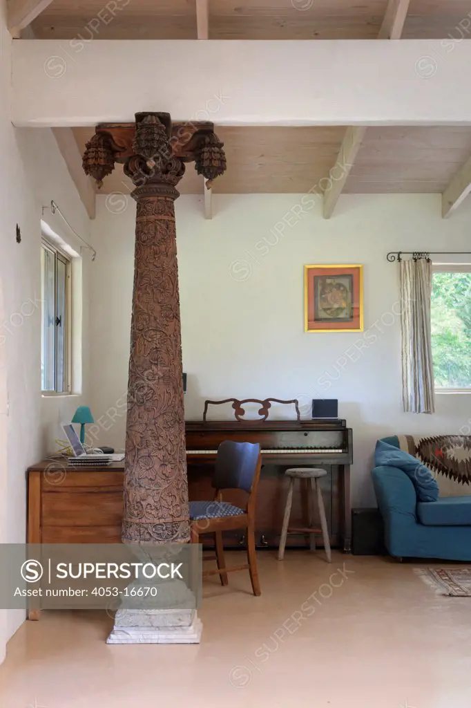 Carved column and piano in living room, New South Wales, Mullumbimby, Australia. 02/05/2012