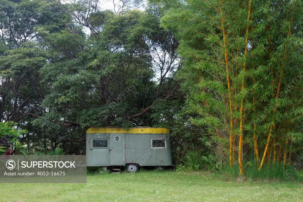 Old trailer parked in garden, New South Wales, Mullumbimby, Australia. 02/05/2012