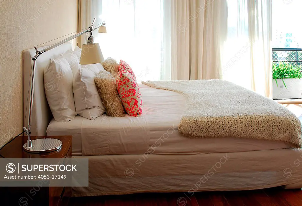Bed and night table in bedroom, Argentina, Argentina.