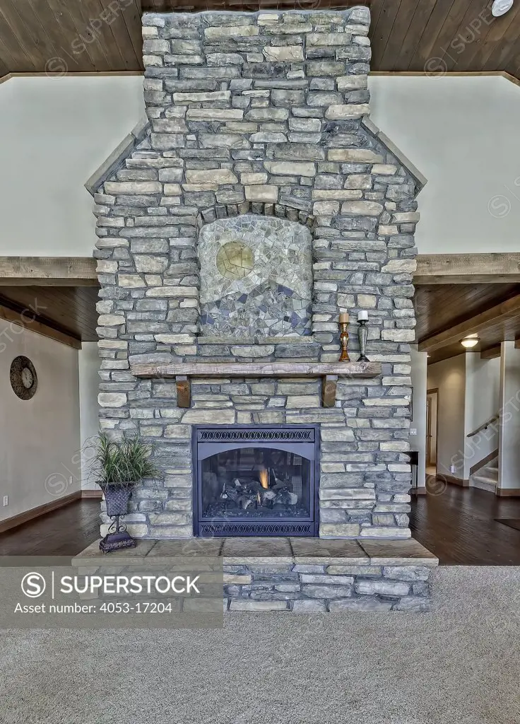 Stone fireplace in middle class house, Colorado, USA. 12/08/2010