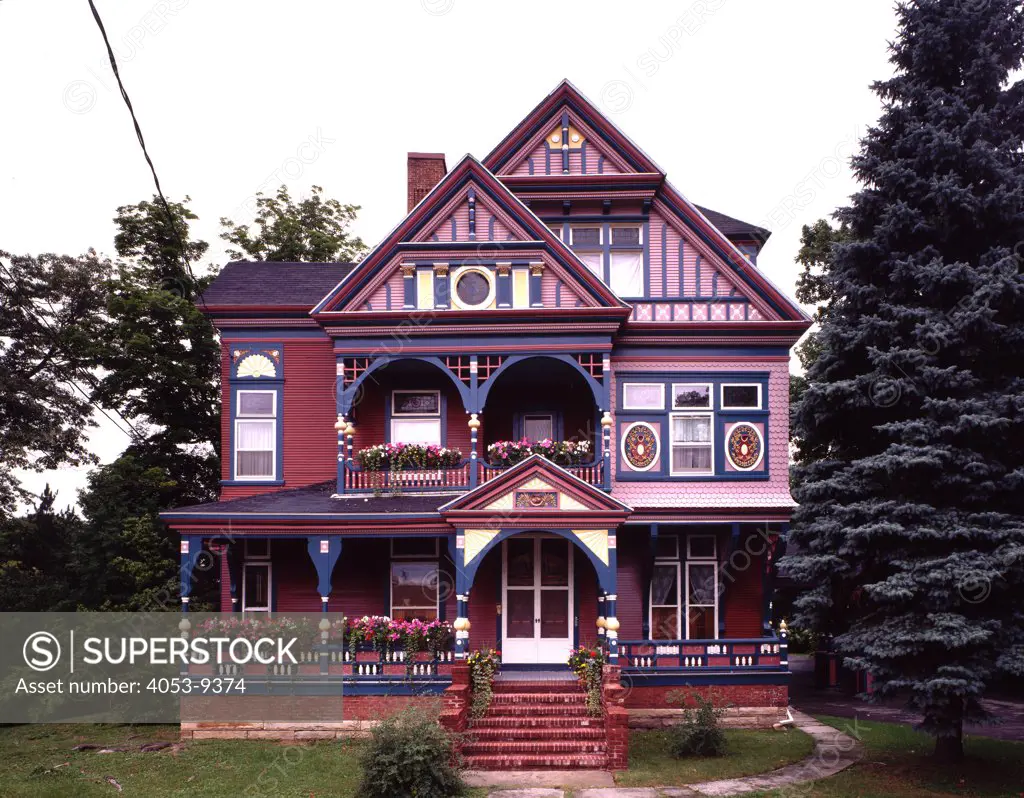 Front exterior view of a colorful Queen Anne Victorian Home