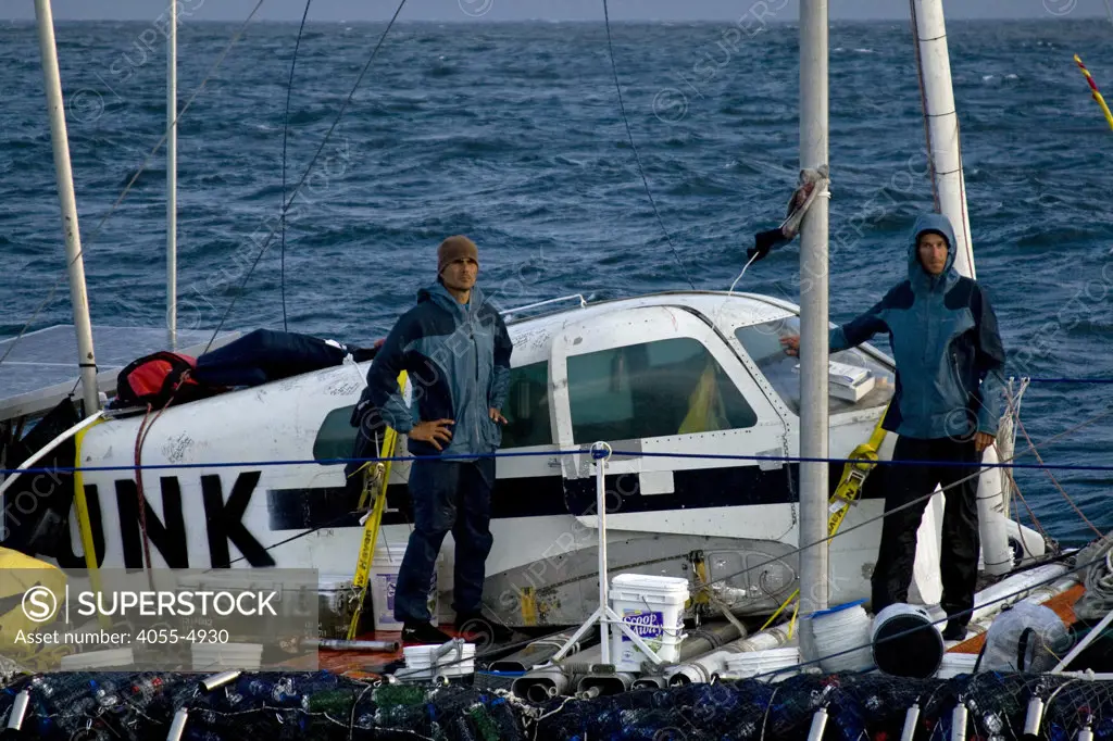 On the thrid day of the trip, with gale force winds approaching, the Junk” finds refuge in a cove off San Nicholas Island. Marcus (l) and Joel (r) prepare for their first night alone without their escort, the Alguita.