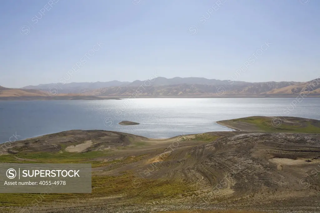 The San Luis Reservoir is a water-storage ""off-stream"" reservoir and is typically low in late summer due to its heavy usage for irrigation, Merced County, California, USA