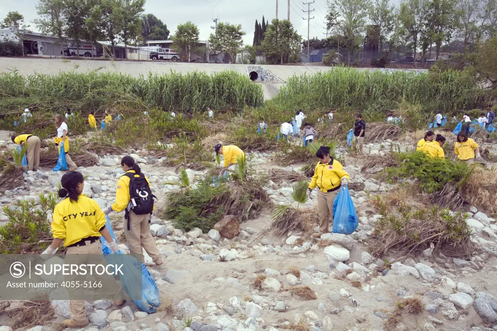 Students from local schools and other volunteers at FoLAR's River School Day of the LA River. This half-day event gives students an opportunity to participate in a River cleanup and educational activities that teach about the connection between storm drains, the River a the ocean and the importance of healthy watershed management. Los Angeles, California, USA.