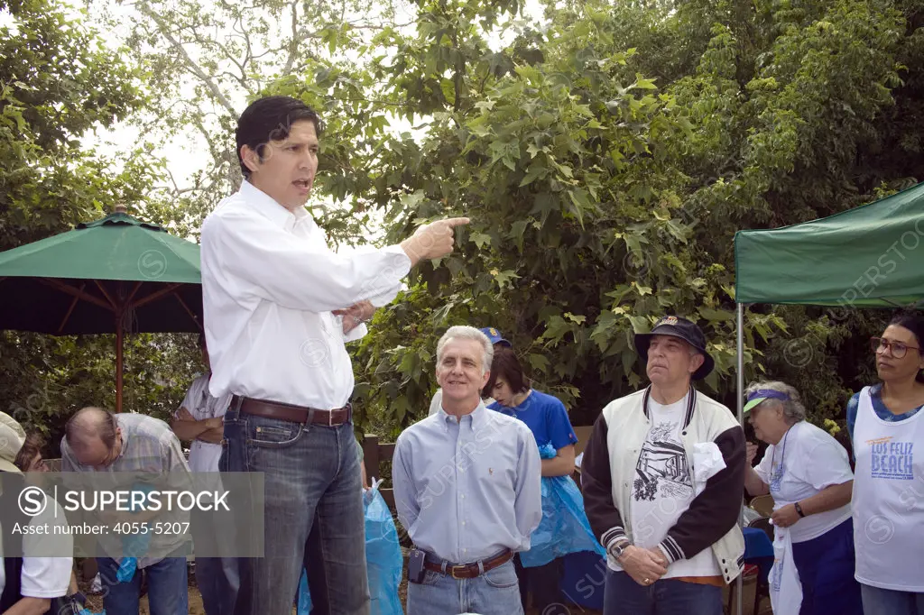State Assemblyman Kevin De León addresses volunteers while FoLAR founder Lewis MacAdams (R) and Assemblyman Paul Krekorian (L) look on. FoLAR' (Friends of the LA River) annual river cleanup, La Gran Limpieza, was held  May 9, 2009. Thousands of volunteers at 14 sites pulled out accumlated trash, mostly plastic bags, from river runoff that might normally find it's way downstream into the Pacific Ocean.