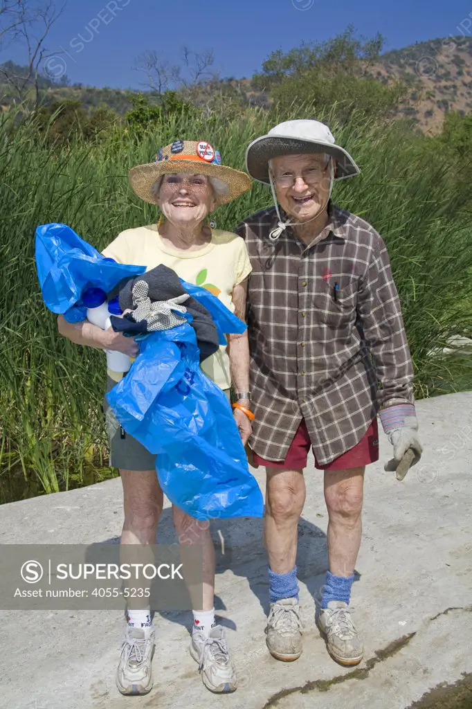 Elderly couple help clean up the Glendale narrows. FoLAR' (Friends of the LA River) annual river cleanup, La Gran Limpieza, was held  May 9, 2009. Thousands of volunteers at 14 sites pulled out accumlated trash, mostly plastic bags, from river runoff that might normally find it's way downstream into the Pacific Ocean.
