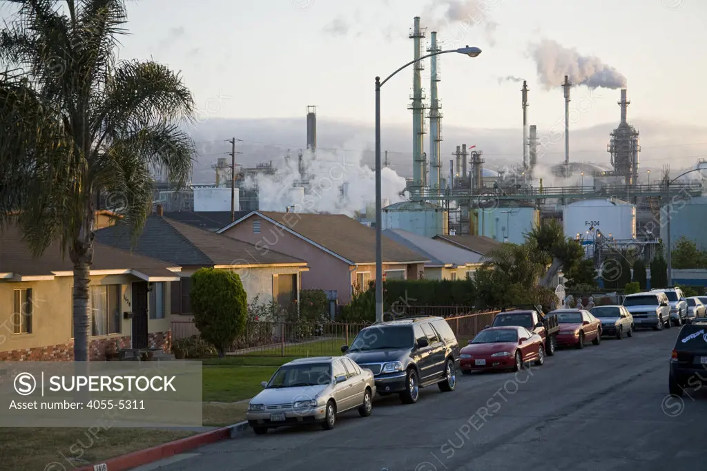 Residential houses next to oil refinery at Wilmington. Wilmington has one the highest risks of cancer due to it's proximity to the Port of Los Angeles at Long Beach, and the several oil refineries in the vicinity. Los Angeles, California, USA