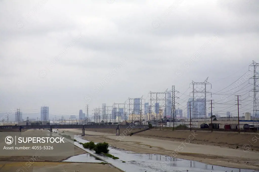 Los Angeles River and Los Angeles skyine in Background. Maywood, Los Angeles, California, USA
