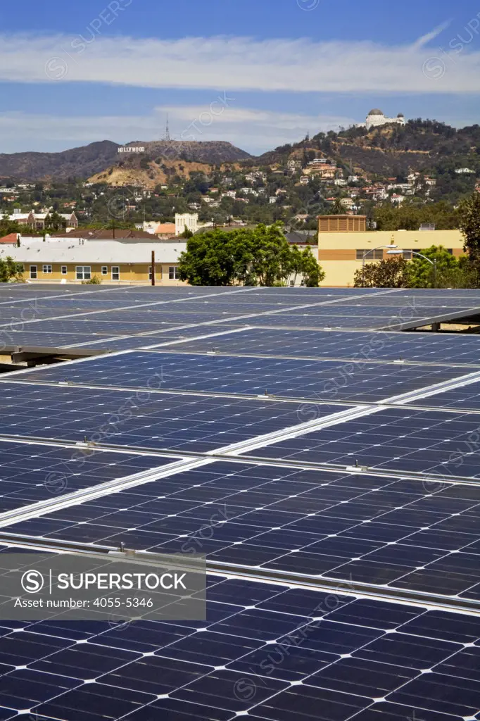 Solar array on rooftop of Asian Pacific Health Care offices with Hollywood Hills and Sign in background, Installation by Martifer Solar USA, Los Angeles, California, USA