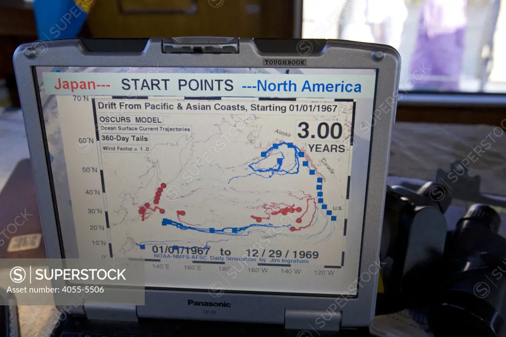 Computer showing three year tracking of ocean drift and currents in the North Pacific Gyre. The ORV Alguita returns to Long beach after four months at sea sampling the waters of the great Pacific garbage patch"" in the North Pacific Subtropical  Gyre (NPSG). The Algalita Marine Research Foundation has been studying and educating the public about the effects of oceanic micro-plastic pollution on the ocean's ecosystem and marine life for over ten years. Long Beach, California, USA.