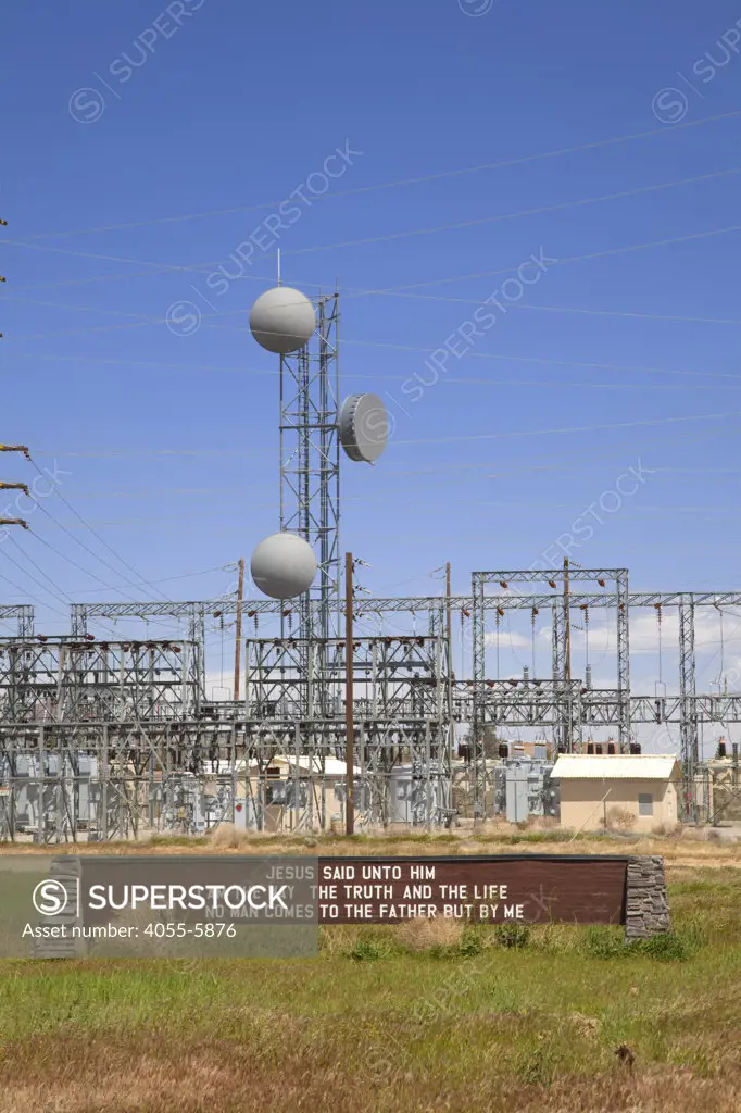 Electric power facility with religious sign, Rosamond, Kern County, California, USA