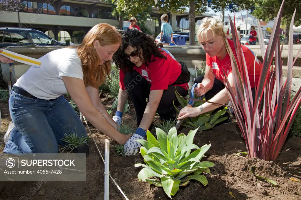Keller Williams volunteers help clean up at John Adams Middle School in Santa Monica. More than 30,000 associates from  Keller Williams Realty across the United States and Canada participate in the third annual RED Day, May 12, 2011. RED Day, which stands for Renew, Energize and Donate,  is a collective service initiative where the companys associates donate a day to give back to the community. Santa Monica, California, USA