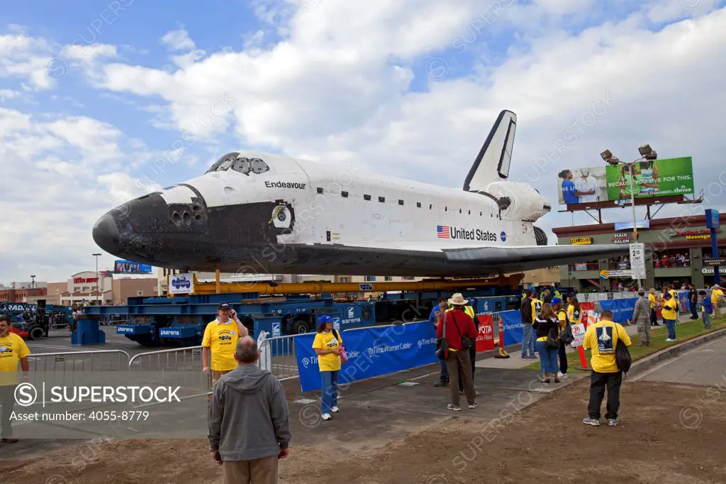 Crowds come out on October 12, 2012, to see the Space Shuttle Endeavour at a parking lot in Westchester, as it is transported over three days, 12 miles from Los Angeles Airport to its new home at the California Science Center. Los Angeles, California