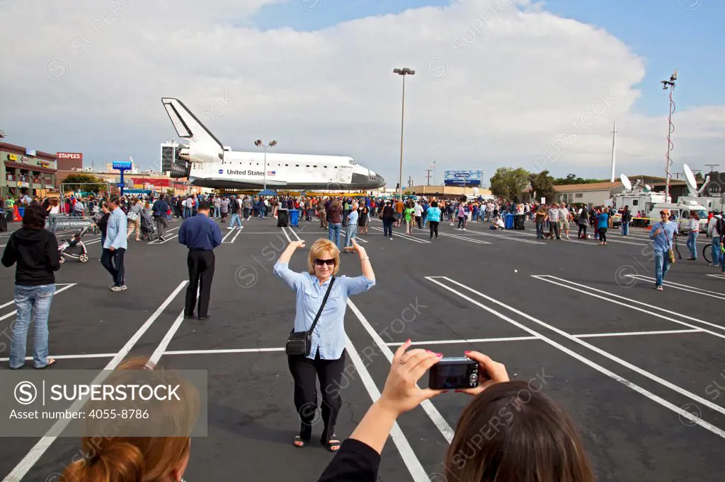 Crowds come out on October 12, 2012, to see the Space Shuttle Endeavour at a parking lot in Westchester, as it is transported over three days, 12 miles from Los Angeles Airport to its new home at the California Science Center. Los Angeles, California