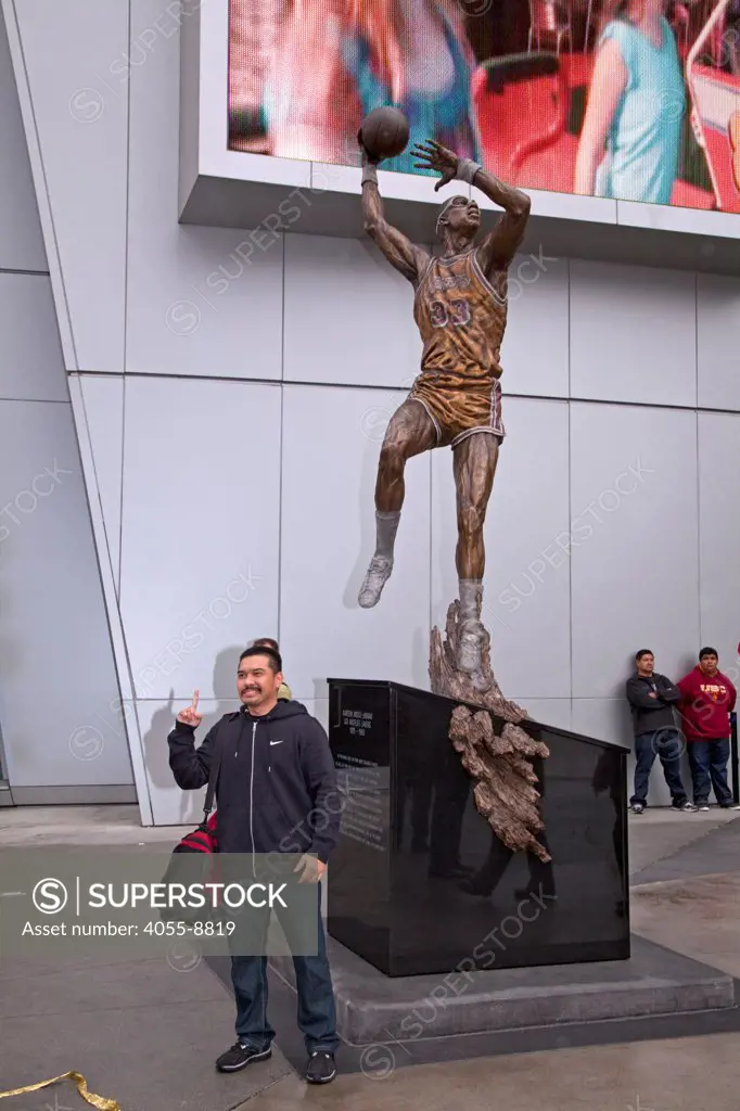 A nearly 16 foot statue captured in bronze, of Kareem Abdul-Jabbar was unveiled On November 16, in front of Staples Center, joining statues of other Laker legends Earvin ""Magic"" Johnson and broadcaster Chic Hearn. Jabbar is posed in his trademark skyhook shot. Los Angeles, California, USA