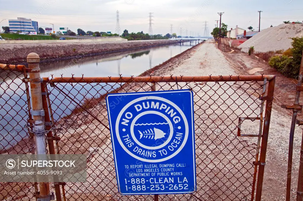 No Dumping in ocean sign along Dominguez Channel, a 15.7 mile stream that drains the Dominguez Watershed, going from its headwaters in Hawthorne and it emptying into the East Basin of the Port of Los Angeles. Carson, California, USA