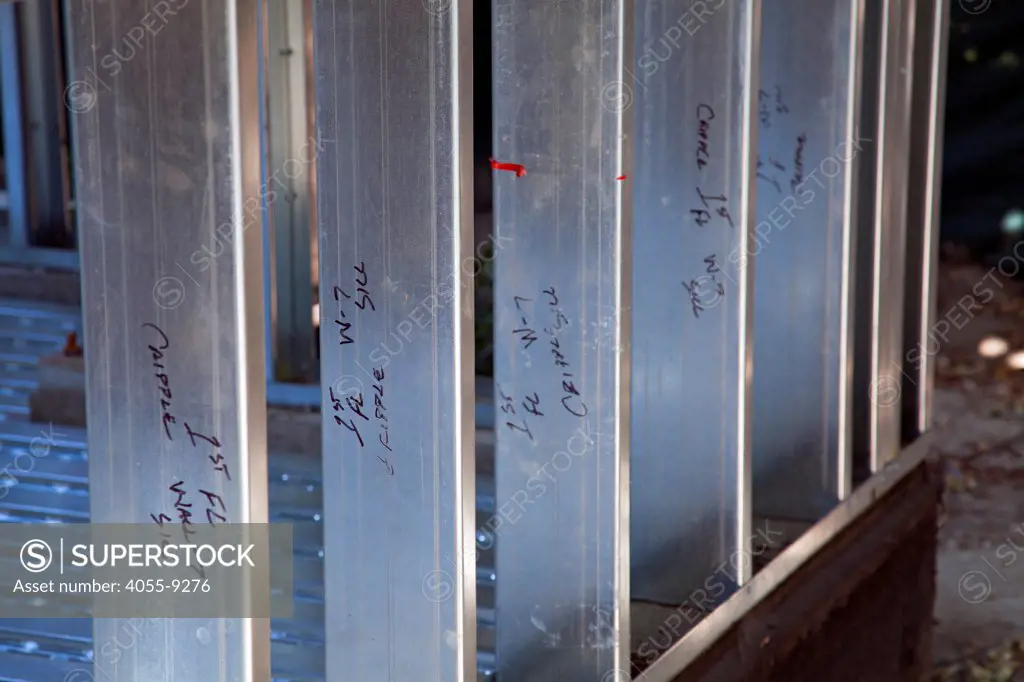 Instructions for assemply are written on the steel studs. Residential home construction site using steel for framing. Steel, while not a common material for residential framing, is 94% recyclable, has been milled locally for this project, and is a more sustainable choice than wood, which is typically used for residential building construction, Los Angeles, California, USA