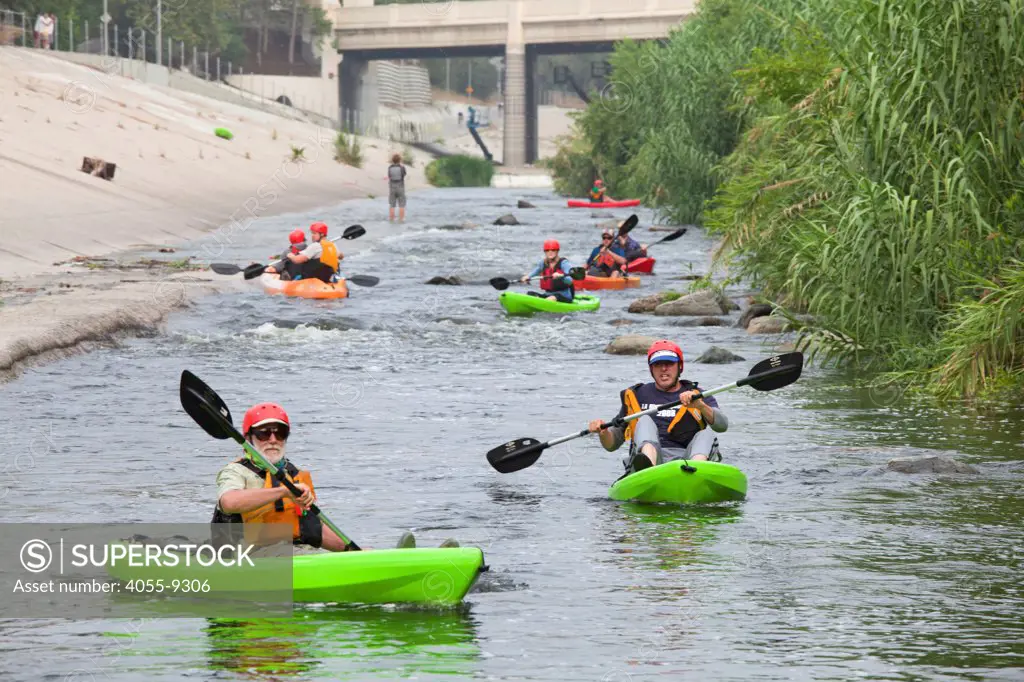Kayakers stretched out along the LA River. On June 1, 2013, George Wolfe and LA River Expeditions leads a kayak tour down the Los Angeles River. On Memorial Day, the Los Angeles River Pilot Recreational Zone officially opened to the public for kayaking, walking, birdwatching, and fishing along a 2.5 mile stretch of the river in the Elysian Valley. Los Angeles, California
