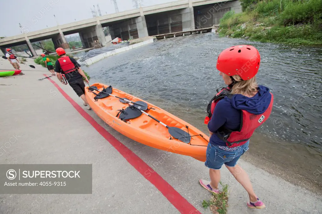 Kayakers launch into the LA River from near Rattlesnake Park. On June 1, 2013, George Wolfe and LA River Expeditions leads a kayak tour down the Los Angeles River. On Memorial Day, the Los Angeles River Pilot Recreational Zone officially opened to the public for kayaking, walking, birdwatching, and fishing along a 2.5 mile stretch of the river in the Elysian Valley. Los Angeles, California