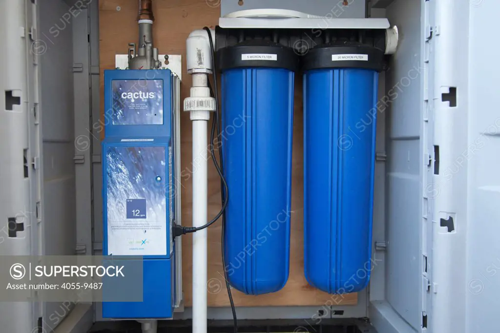UV water filter and micron filters for harvested rainwater on Green home that is off the grid. Solar power and a rainwater harvesting system supply all the energy and water for this home in Los Angeles, California, USA