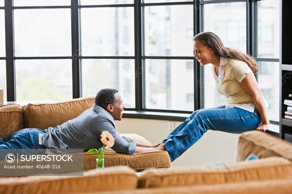 Couple relaxing in loft apartment