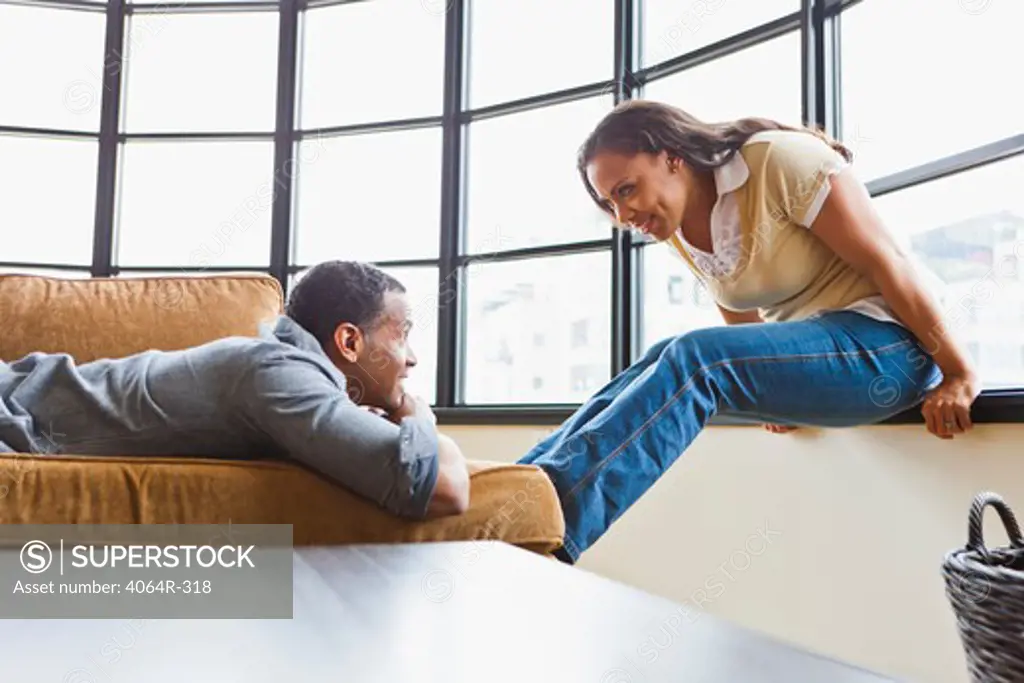 Couple relaxing in loft apartment