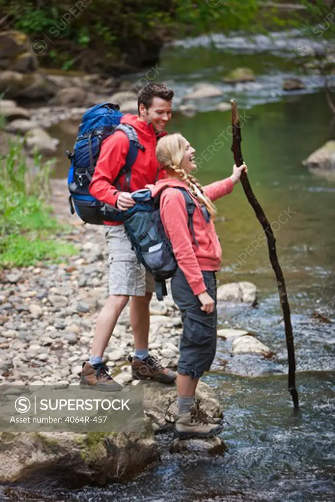 Portland, Oregon, USA, Couple standing at creek