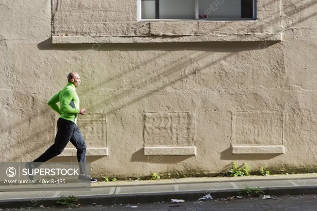 Man jogging up street
