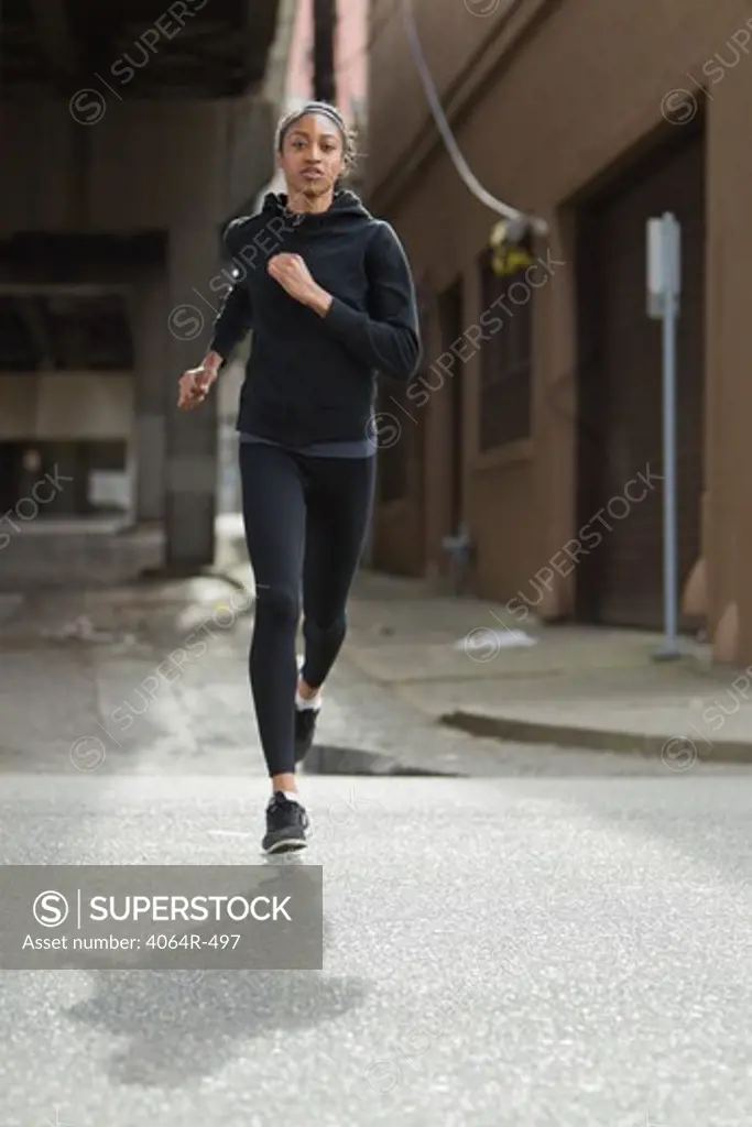 Woman jogging in street