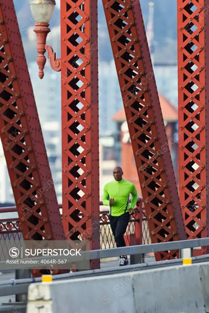 Man running along bridge