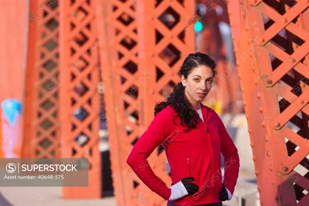 Portrait of female runner on bridge