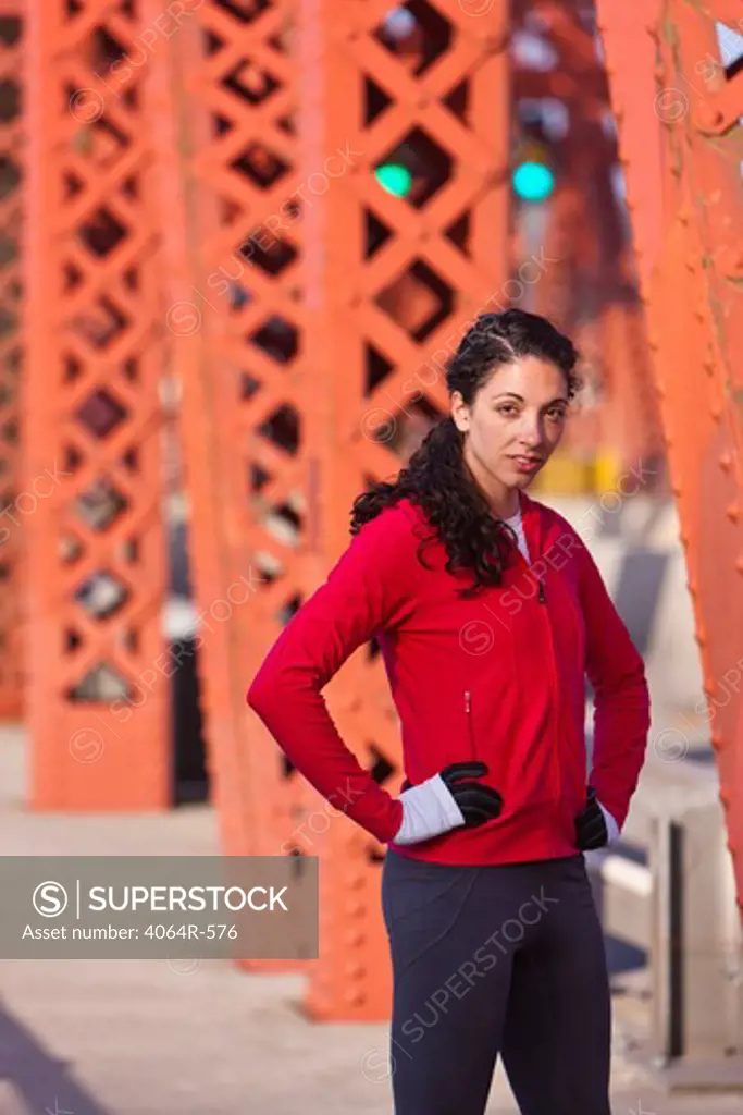 Portrait of female runner on bridge