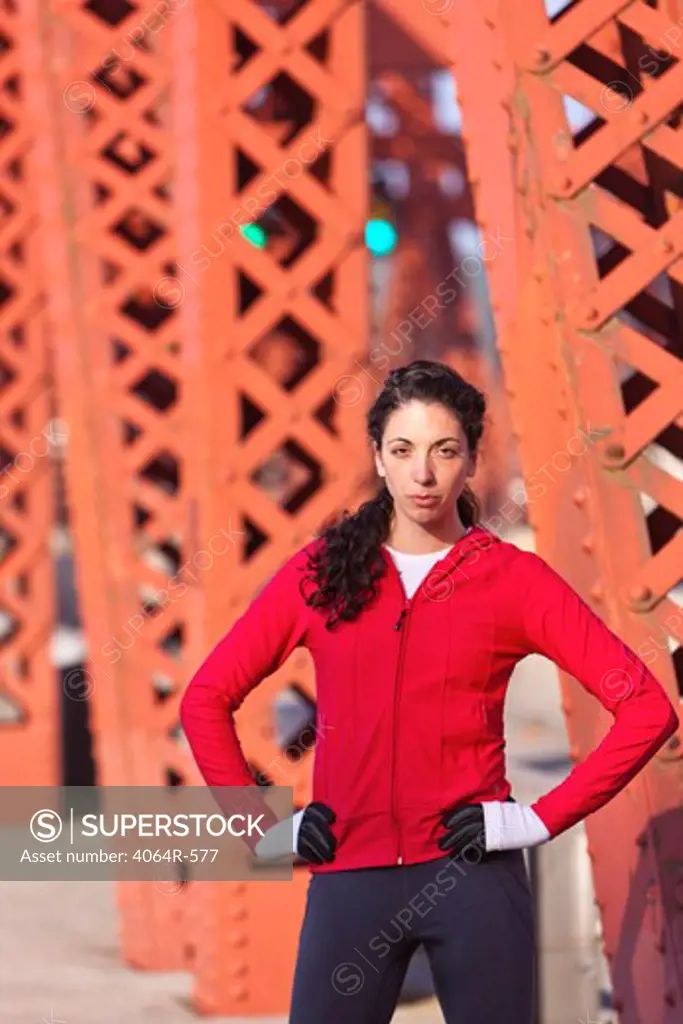 Portrait of female runner on bridge