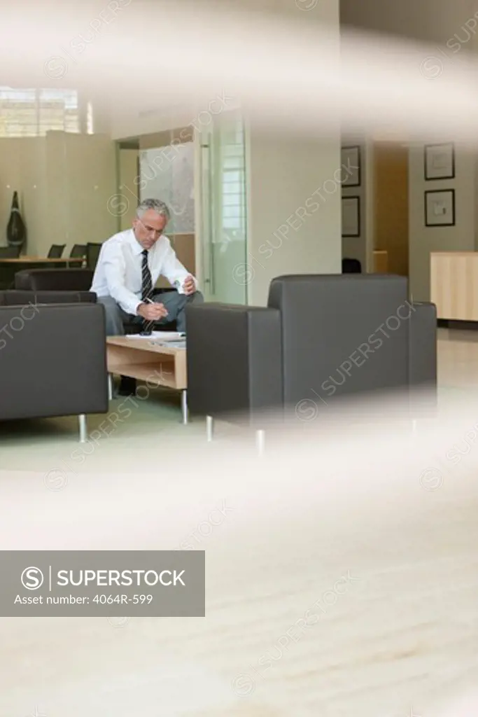 Businessman waiting in office lobby