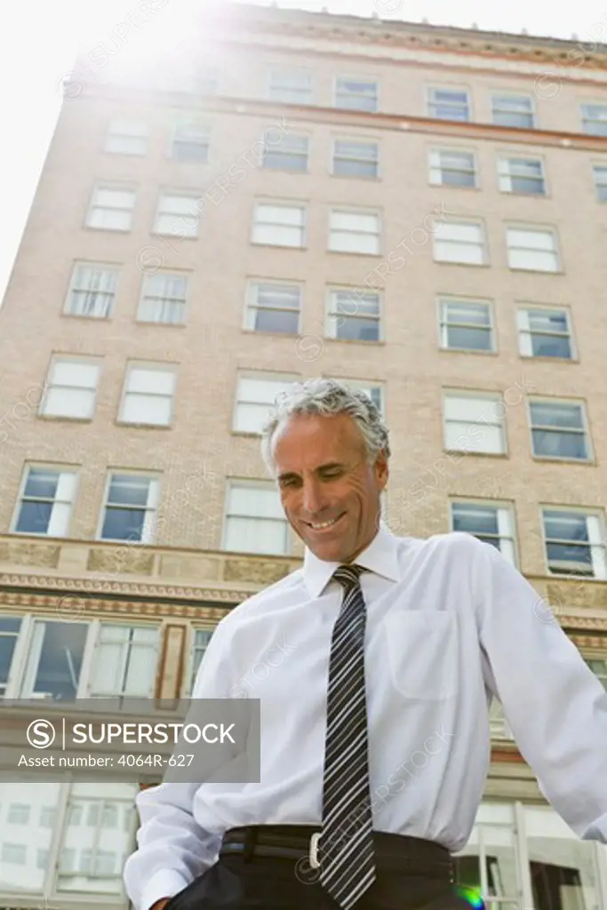 Businessman outside office in city