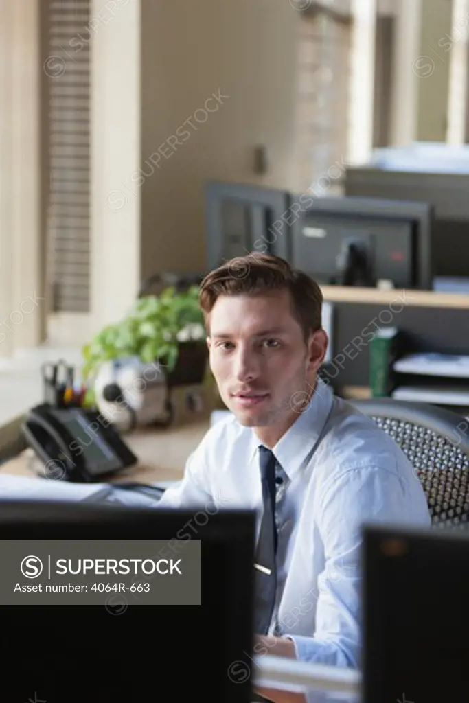 Businessman at his desk in office