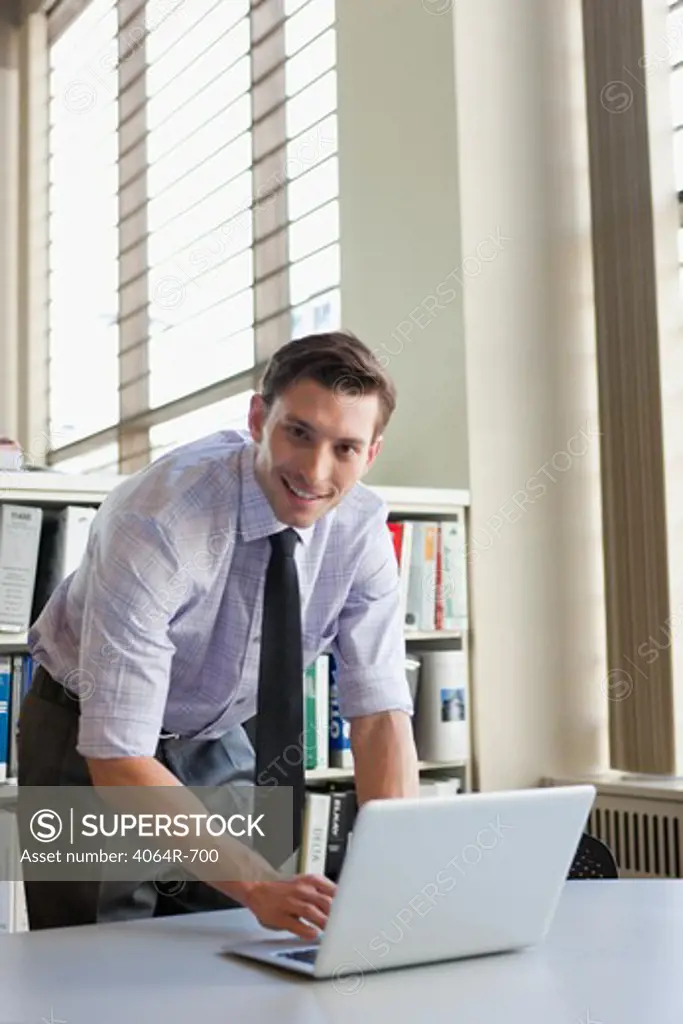 Businessman working at laptop